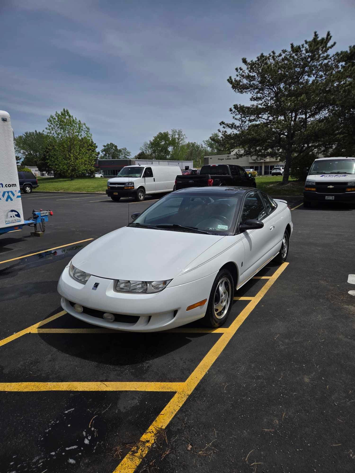 White Saturn coupe cleaned up and ready for the customer